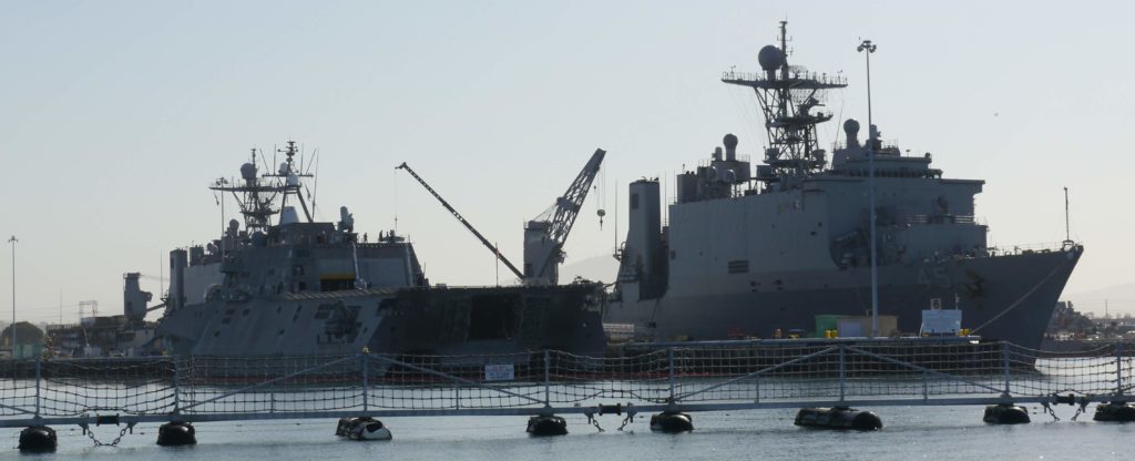 USS Independence (LCS-2) and USS Comstock (LSD-45) docked in Naval Base San Diego.